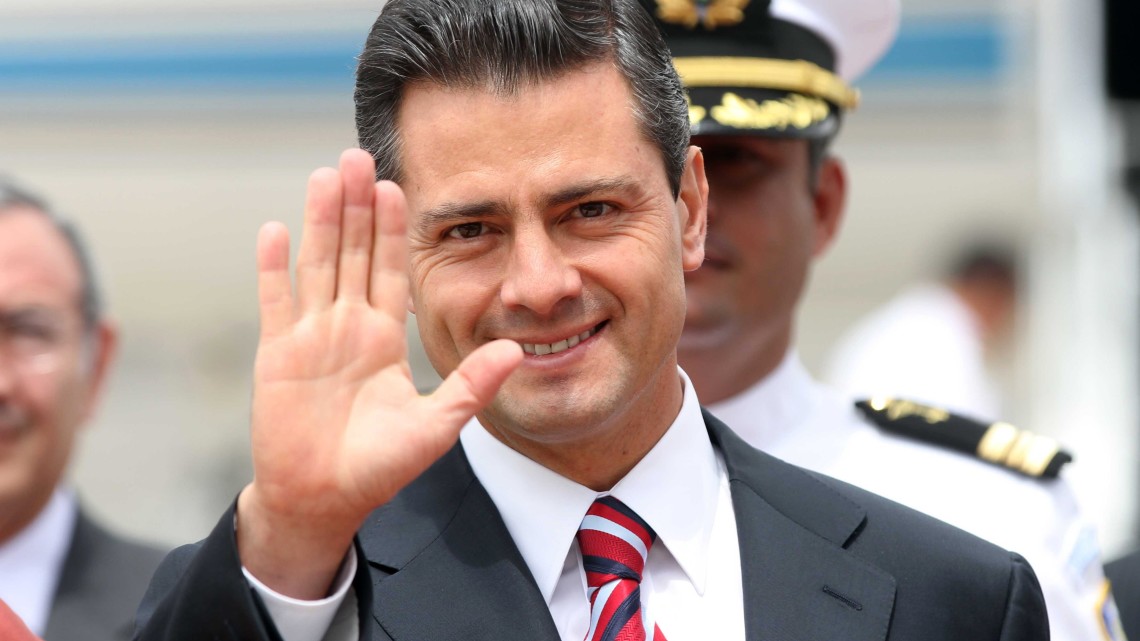 Handout picture released by Guatemala's Presidency press office showing Mexican President-elect Enrique Pena Nieto waving at the press upon his arrival at the Guatemalan Air Force (FAG) base in Guatemala City on September 17, 2012. President-elect Enrique Pena Nieto launched a tour of Latin America on Sunday with an agenda stressing security, trade and immigration. He will visit Guatemala, Colombia, Brazil, Chile, Argentina and Peru.  AFP PHOTO/PRESIDENCIA   ---   RESTRICTED TO EDITORIAL USE - MANDATORY CREDIT "AFP PHOTO/PRESIDENCIA" - NO MARKETING NO ADVERTISING CAMPAIGNS - DISTRIBUTED AS A SERVICE TO CLIENTS