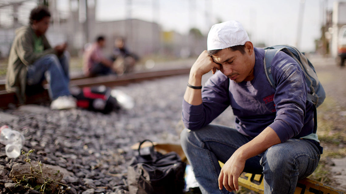 Carlos Amiltar, a migrant from Honduras, rests as he waits for a train traveling north, in Lecheria, Mexico, Thursday, May 17, 2012. Every year, tens of thousands of Central American migrants embark on the dangerous journey through Mexico to try to cross into the U.S. (AP Photo/Alexandre Meneghini)