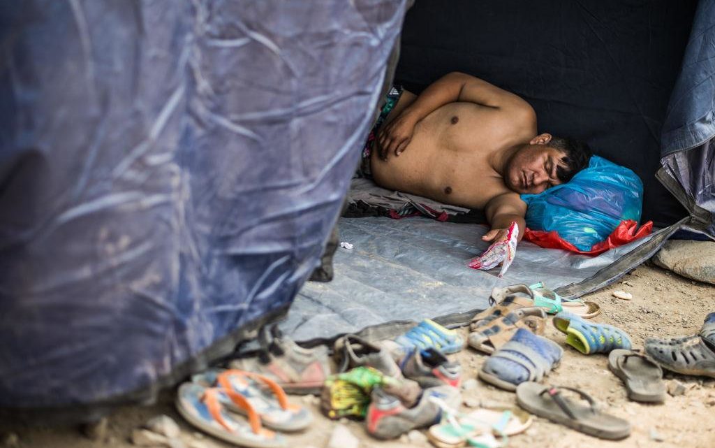 A local resident affected by the flash floods sleeps in one of the tents set up by volunteers and authorities in Huachipa district, east of Lima, on March 19, 2017.
El Nino-fuelled flash floods and landslides hit parts of Lima, where most of the water distribution systems have collapsed due to unusual heavy seasonal downpours and people are facing drinking water shortages. / AFP PHOTO / Ernesto BENAVIDES        (Photo credit should read ERNESTO BENAVIDES/AFP/Getty Images)